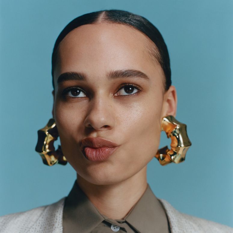 Image may contain: Head, Person, Face, Body Part, Neck, Accessories, Earring, Jewelry, Photography, Portrait, and Adult