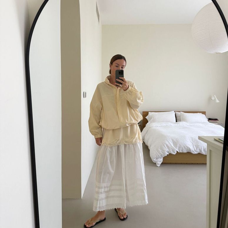 Image may contain: Photography, Clothing, Sleeve, Indoors, Footwear, Shoe, Furniture, Adult, Person, Bed, Bedroom, and Room